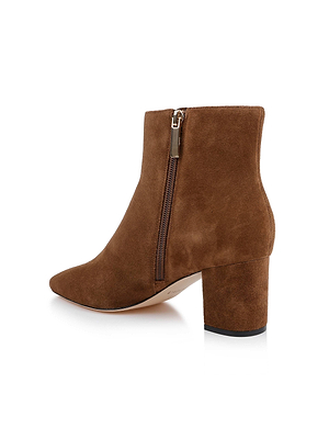 The Melanie Suede Bootie by L'AGENCE, shown on a white background, features brown suede, a block heel, and a side zipper.