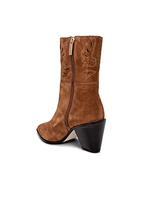 The Anne Western Bootie is a brown suede cowboy boot with a side zipper, decorative stitching, pointed toe, and chunky angled heel, displayed against a white background.