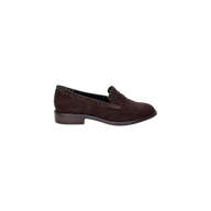 The Avriel Brogue Loafer, crafted in dark brown suede with a low heel, visible stitching, and a classic penny strap detail, is displayed on a plain white background. This elegant almond toe loafer combines timeless style with modern femininity.