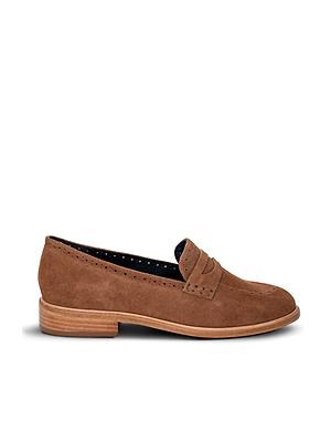 The Avriel Brogue Loafer is a tan suede shoe with an almond toe, low wooden heel, top-edge broguing, and a classic penny slot on the tongue, shown in side profile against a white background.