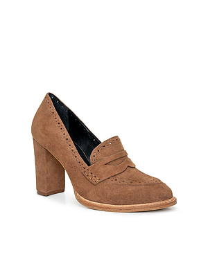 The Bea Brogue Block-Heel Loafer features brown suede, a chunky block heel, decorative stitching, and a classic penny slot—ideal for those looking for standout women’s statement shoes.