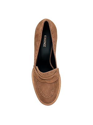 Top view of the Bea Brogue Block-Heel Loafer in tan suede, featuring brogue detailing, a rounded toe, and a black insole with gold L’AGENCE text—an elegant statement piece on a white background.