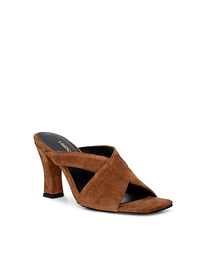 The Mirabelle Suede Sandal is a brown buckskin high-heeled mule with crisscross straps, an open toe, and a memory foam insole, shown against a white background.
