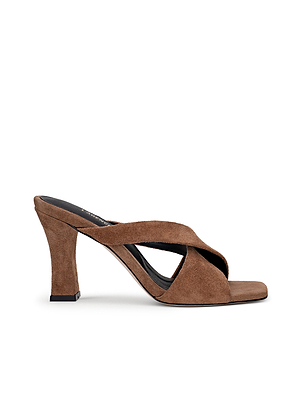 The Mirabelle Suede Sandal features a tan suede finish, wide crisscross straps, open toe, chunky heel, black sole, and a cushioned memory foam insole for comfort all day.