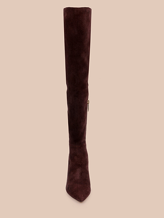 A single Nanette Boot in tall, mahogany brown suede with a pointed toe and a side zipper is displayed from the front against a plain beige background.