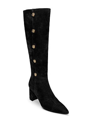 The Octavie Knee-High Boot by L'AGENCE features black suede, a pointed toe, mid-block heel, and five gold decorative side buttons.