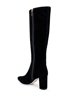The Octavie Knee-High Boot by L'AGENCE features black suede, a mid-block heel, pointed toe, and a gold side zipper.