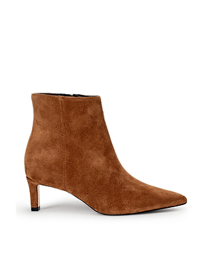 The Lilly Kitten-Heel Bootie is a brown suede city boot with a pointed toe and low kitten heel, shown in side profile against a white background.