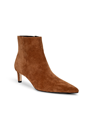 The Lilly Kitten-Heel Bootie is a brown suede city boot with a pointed toe and low kitten heel, shown on a white background.