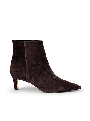 The L'AGENCE Lilly Kitten-Heel Bootie is a dark brown suede city boot with a pointed toe and low kitten heel, shown in profile against a plain white background.