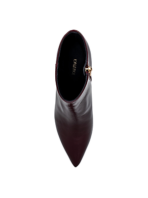 A top-view of the sleek Lilly Kitten-Heel Bootie by L'AGENCE, featuring dark burgundy smooth leather, a pointed toe, small side buckle detail, and an elegant kitten heel.
