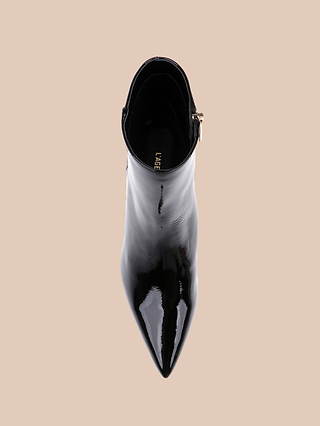 Top view of the Lilly Kitten-Heel Bootie, a shiny black patent leather pointed toe bootie with a side zipper, displayed against a plain beige background.