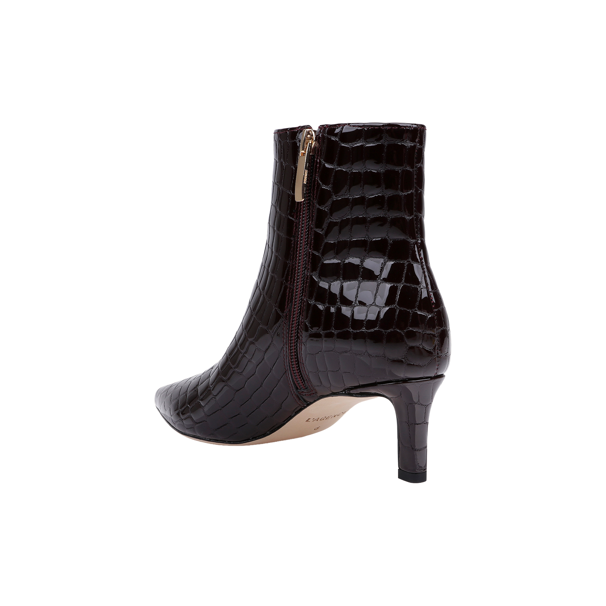Sure Here’s the sentence rewritten using the product name: The Lilly Kitten-Heel Bootie is a dark brown, crocodile-embossed leather city boot featuring a pointed toe, side zipper, and mid-height kitten heel, displayed against a white background.