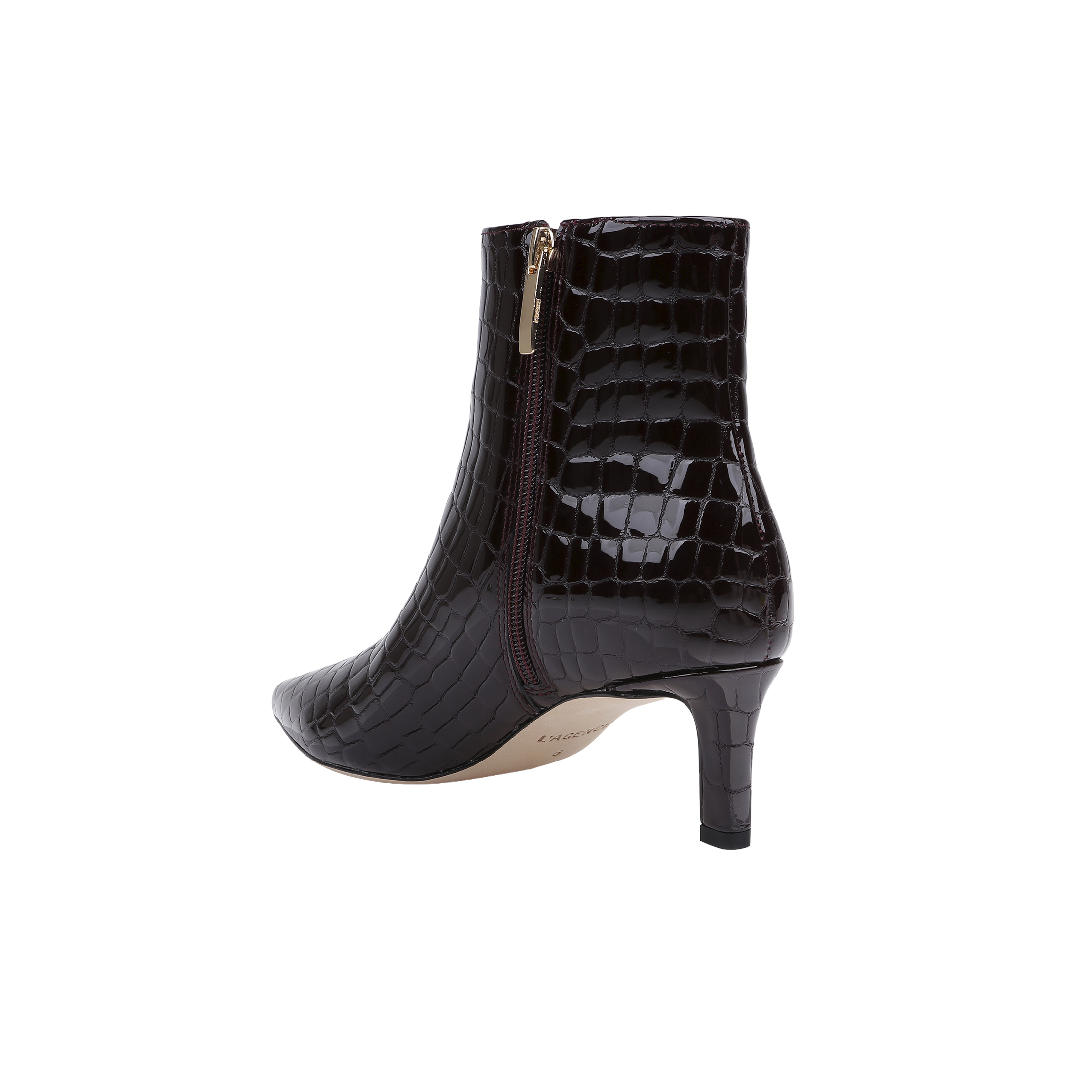Sure Here’s the sentence rewritten using the product name: The Lilly Kitten-Heel Bootie is a dark brown, crocodile-embossed leather city boot featuring a pointed toe, side zipper, and mid-height kitten heel, displayed against a white background.