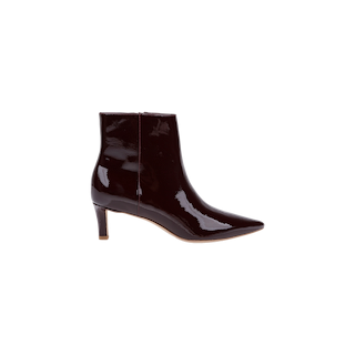 The Lilly Kitten-Heel Bootie, crafted in shiny dark brown patent leather with a pointed toe and mid-height kitten heel, is shown in profile against a plain white background.