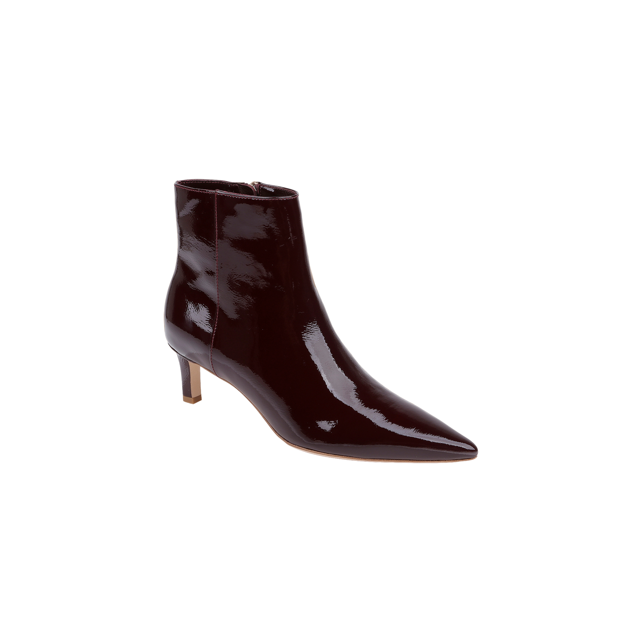 The Lilly Kitten-Heel Bootie, crafted in dark burgundy patent leather with a pointed toe and a mid-height kitten heel, is displayed on a light gray background.