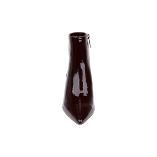 The Lilly Kitten-Heel Bootie, a glossy, dark burgundy city boot crafted from patent leather with a pointed toe and side zipper, is shown from the front against a plain white background.