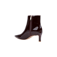 The Lilly Kitten-Heel Bootie is crafted from shiny dark burgundy patent leather and features a pointed toe, side zipper, and mid-height kitten heel, shown on a plain white background.