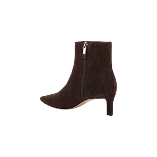 The Lilly Kitten-Heel Bootie is a dark brown suede city boot featuring a pointed toe, side zipper, and a sleek mid-height stiletto heel, displayed on a plain white background.