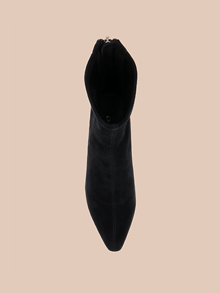 A single Salome Stretch Suede Boot in black is viewed from above, featuring a stylish block heel and displayed on a plain beige background.