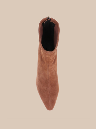 Top view of a single Salome Stretch Suede Boot in brown, featuring a pointed toe and a stylish block heel, set against a plain beige background.