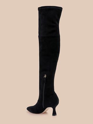 The Clarin Over-the-Knee Boot, crafted in black suede with a chic flared heel and convenient side zipper, is displayed on a beige background.