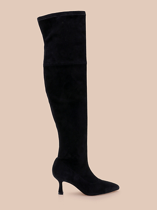 The Clarin Over-the-Knee Boot in black suede features a pointed toe and a stylish mid-height flared heel, displayed on a beige background.