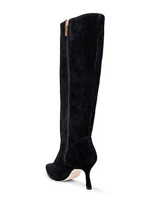 The Marya Knee-High Boot by L'AGENCE features black suede, a pointed toe, slim stiletto heel, gold side zipper, and a memory foam insole for comfort. Its light-colored sole contrasts with the boot's sleek design.