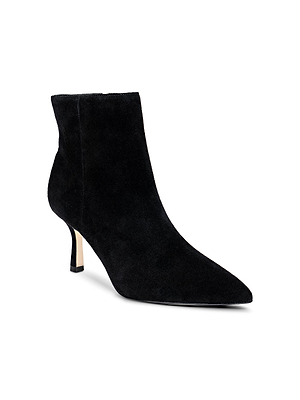 The Sylvie Suede Bootie by L'AGENCE is a minimalist black suede bootie with a pointed toe and slim mid-height heel, shown on a white background.