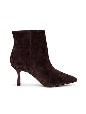 The L'AGENCE Sylvie Suede Bootie features dark brown suede, a pointed toe, and a slim high heel, displayed in side profile on a white background.