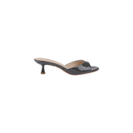 The Arleen Kitten-Heel Mule is a black open-toe mule featuring a single wide strap made from crocodile-embossed leather, a low curved kitten heel, and a tan memory foam insole, shown on a plain white background.