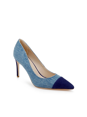 The Kendelle Denim Pump is a women’s classic shoe with a light blue denim body and a contrasting navy suede cap toe, displayed against a white background.