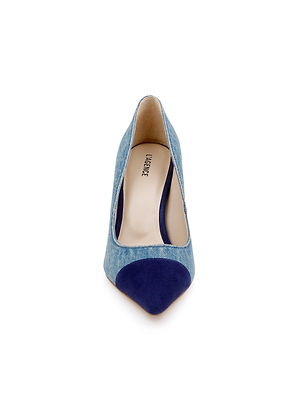 Front view of the Kendelle Denim Pump, featuring a blue denim body and navy suede cap toe, displayed on a white background. The light beige insole is stamped with the Vince brand name.