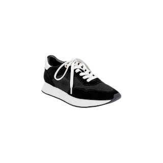 The Deepa Platform Sneaker is shown on a plain white background, featuring a black and white design with white laces, black mesh and suede accents, a white sole, and a comfortable memory foam insole.