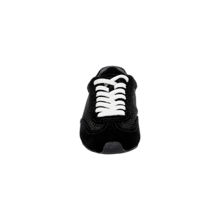 The Jarah Sneaker is shown from the front on a plain white background, featuring a black mesh texture, white laces, a black sole, and a comfortable memory foam insole for added cushioning.