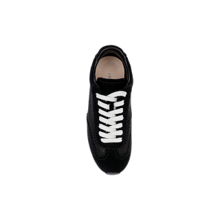 Top view of the Jarah Sneaker, crafted with black suede and accented by crisp white laces, displayed on a plain white background. This stylish sneaker features a cushioned memory foam insole for all-day comfort.