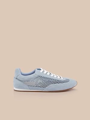 The Jarah Sneaker features a retro-inspired design in light blue suede with white laces, mesh side panels, and suede accents at the toe and heel, shown against a beige background.
