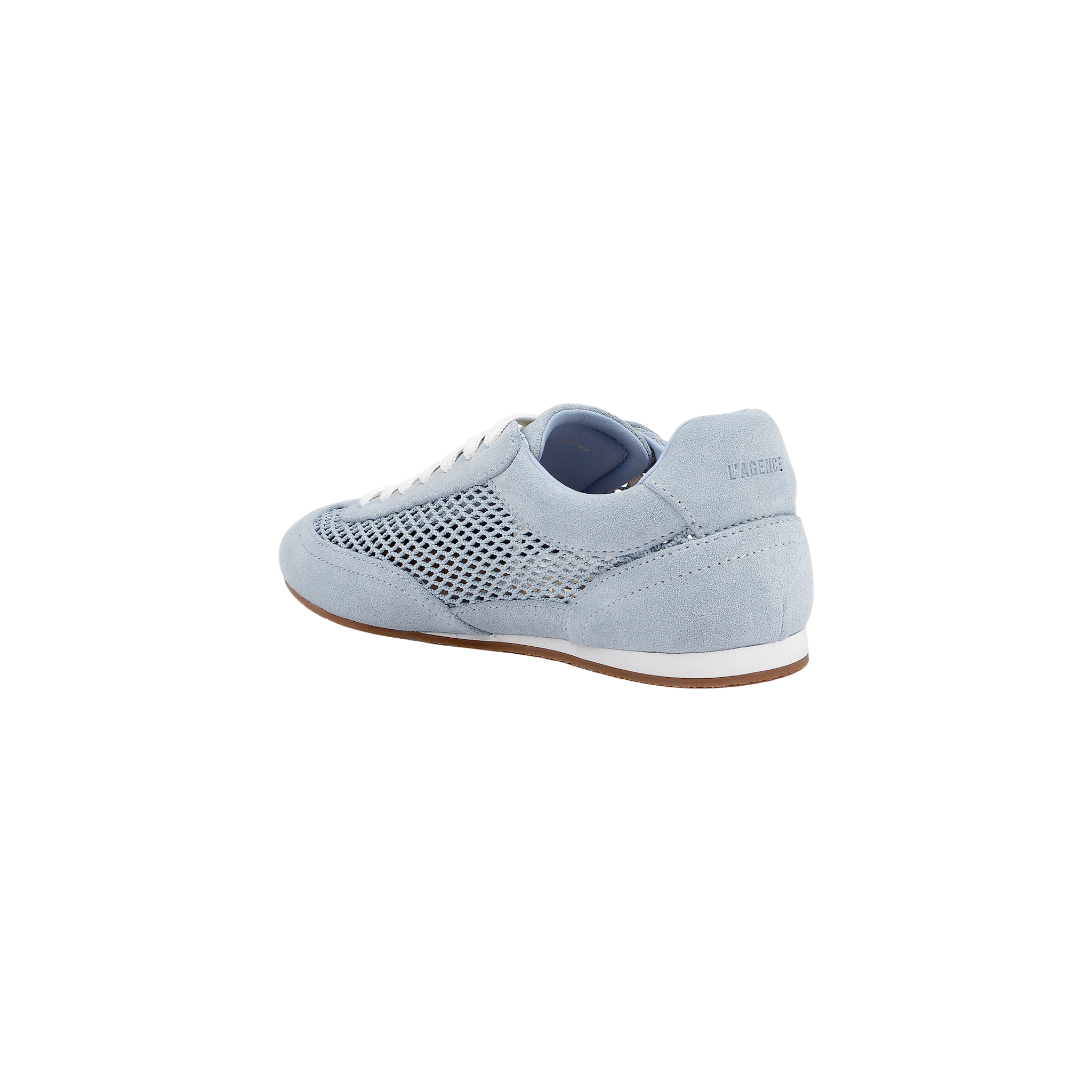 The Jarah Sneaker showcases a retro-inspired design with light blue suede, white laces, a mesh side panel, and a brown sole. Pictured from the back at an angle, the sneaker features the brand name subtly displayed on the heel.