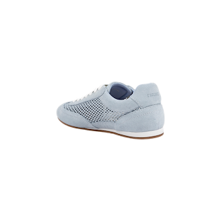The Jarah Sneaker features light blue suede and mesh, white laces, a brown sole, and a raised heel. Shown at an angle highlighting the side and back, this retro style displays the brand name embossed on the heel tab.