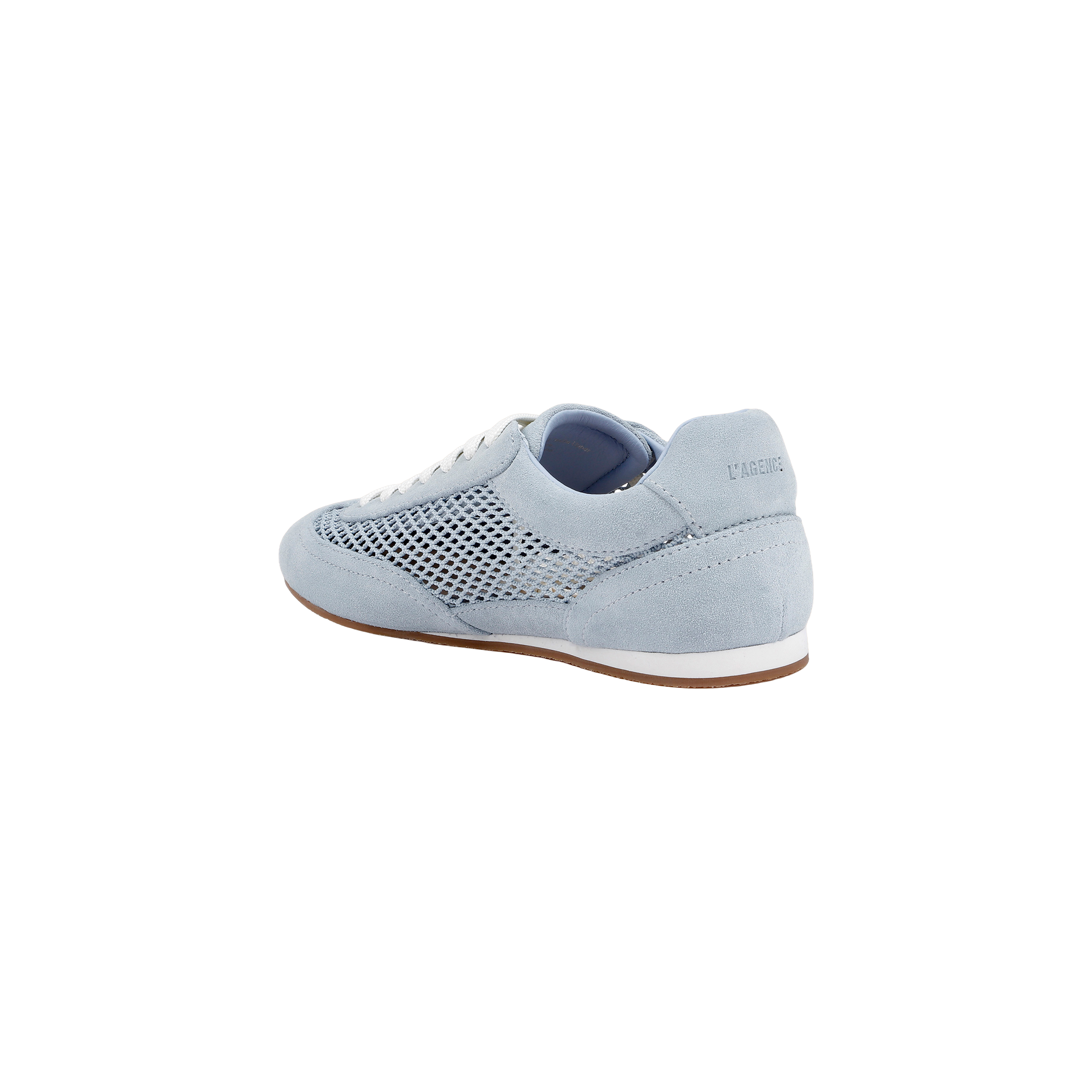 The Jarah Sneaker showcases a retro-inspired design with light blue suede, white laces, a mesh side panel, and a brown sole. Pictured from the back at an angle, the sneaker features the brand name subtly displayed on the heel.
