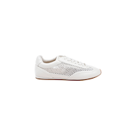 Introducing the Jarah Sneaker: This retro-inspired shoe showcases a white leather upper with mesh side detailing and a brown sole, displayed in profile against a plain white background. Its design is finished with a plush memory foam insole, ensuring lasting comfort.