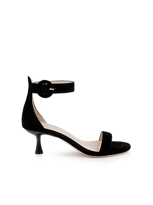 The Andelle Kitten-Heel Sandal features black suede, a memory foam insole, open toe, wide front strap, and ankle strap with round buckle, shown in side profile on a white background.