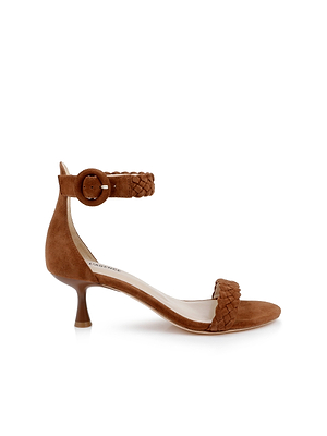 The Andelle Kitten-Heel Sandal features brown woven suede, a low curved heel, braided ankle and toe straps with a round buckle, plus a memory foam insole for comfort. Shown in side profile on a white background.