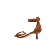 The Andelle Kitten-Heel Sandal is a brown heeled sandal featuring a braided front strap and braided ankle strap, open toe, and slim, curved kitten heel. Crafted from woven suede, this stylish sandal includes a memory foam insole for added comfort. The shoe is shown on a plain white background.