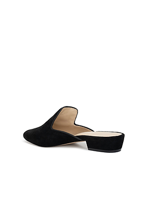 The Como Slipper is a black suede, backless mule with a low block heel, memory foam insole, beige lining, and pointed toe, shown angled on a white background.
