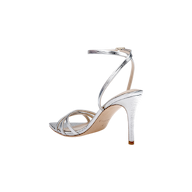 Dua Leather Sandal in metallic silver features a lizard-embossed finish, thin strappy stiletto heel design, adjustable ankle strap with buckle closure, memory foam insole for added comfort, beige sole, and an open toe.