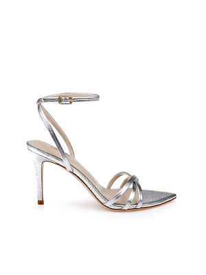 The Dua Leather Sandal is a silver lizard-embossed leather strappy sandal with a thin ankle strap, delicate crossed toe straps, and a pointed toe on a stiletto heel, shown against a white background.