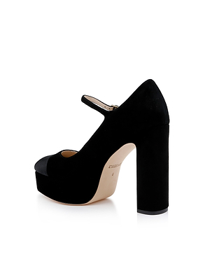 The Lilles Platform Pump is a black suede Mary Jane with a thick high heel, single strap, and modern square toe pump silhouette, shown on a white background.