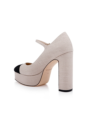 The Lilles Platform Pump is a beige Mary Jane with a thick block heel, chunky sole, black capped toe, and single strap across the instep.