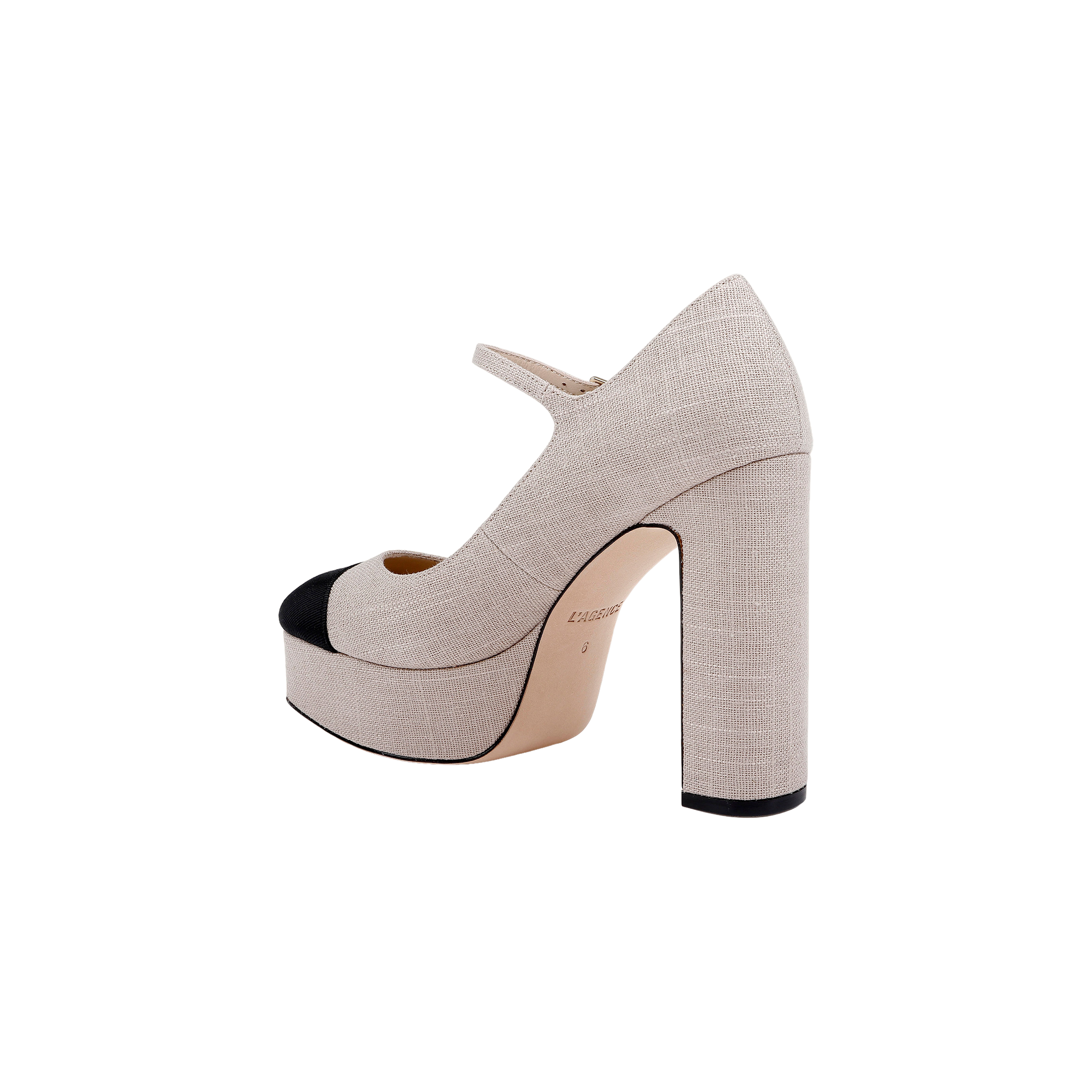 The Lilles Platform Pump is a high-heeled Mary Jane featuring beige fabric, a black toe cap, block heel, square toe, and an ankle strap, shown against a plain white background.